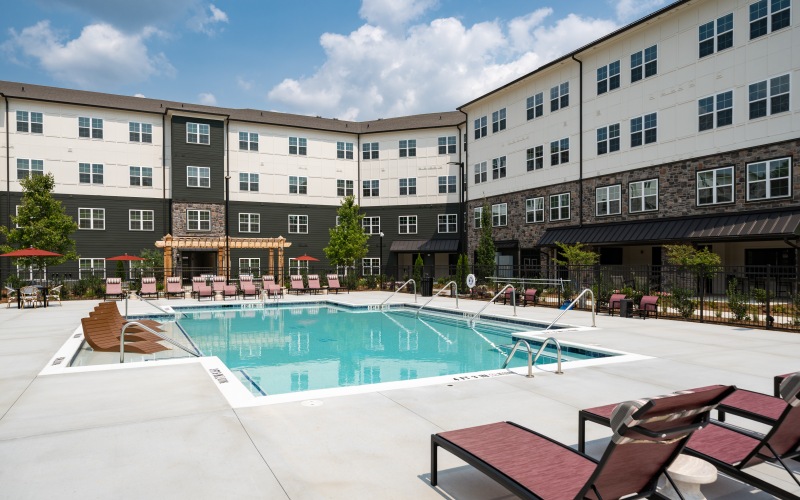 A pool with lounge chairs at Altera Union City Fairburn apartments 