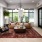Well-lit lounge with a leather sofa and tall windows