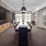 a spacious room with a long table and a big window