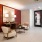 a sitting area with a red wall
